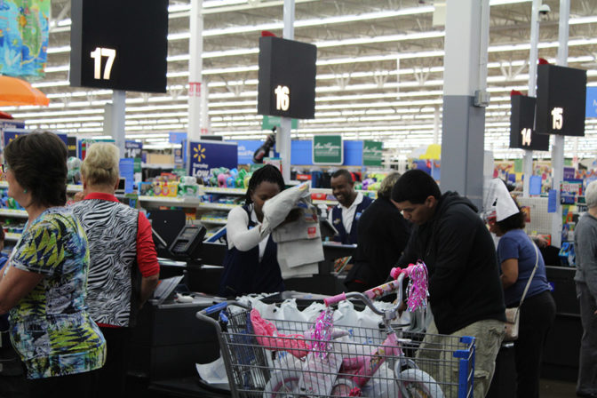 Parents Shopping for Christmas Presents | The Joy of Giving supports families in need in Collier County